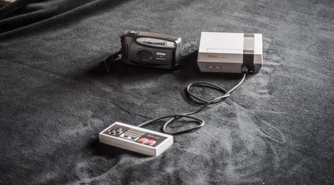 NES console beside black camera